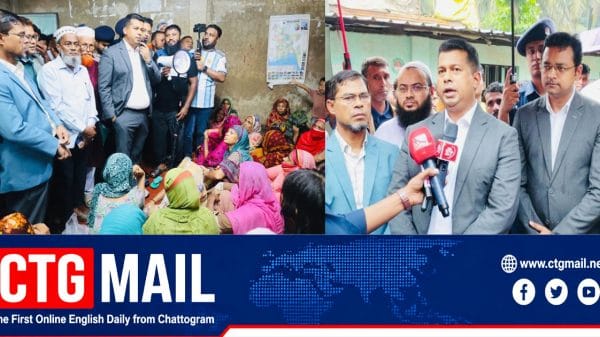 Chattogram Deputy Commissioner Jahidul Islam Mia talks to residents at a temporary shelter during heavy rainfall and landslide warnings.